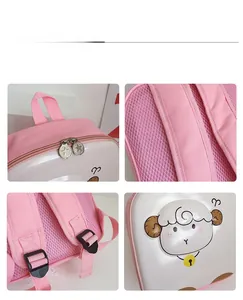 Detail view of pink eggshell backpack with cartoon sheep, star zippers and mesh straps