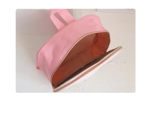 Internal view of pink and white canvas toddler backpack with smooth zipper closure