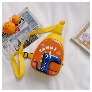 Detail of yellow dinosaur egg crossbody bag with adjustable strap and YAWN text