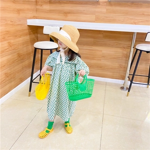 Kids hollow beach basket paired with a green diamond pattern puff sleeve summer dress