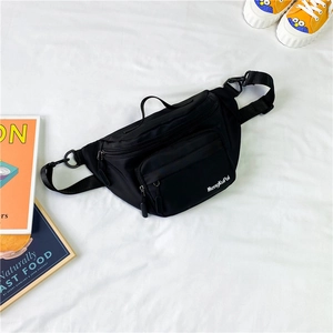 Kids black nylon chest bag with adjustable strap and front zip pocket for outdoor travel