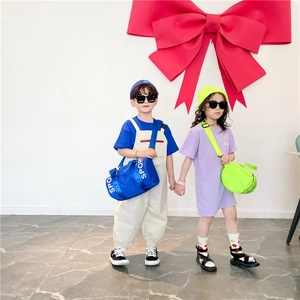 Kids large capacity sport crossbody bag shown with trendy summer street style outfits