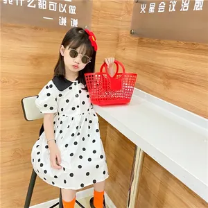 Cute white polka dot girl's dress with Peter Pan collar and puff sleeves for summer