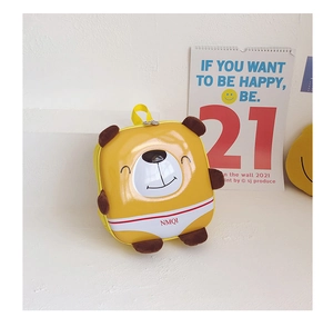Close-up of a yellow bear eggshell backpack for kids with a cute 3D cartoon design