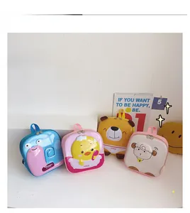 Flat lay of four colorful 3D eggshell backpacks for kids with cute animal patterns