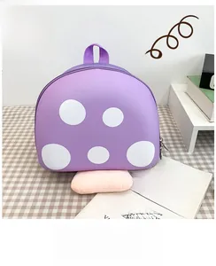 Detail of purple mushroom backpack with white dots and zipper closure for kids