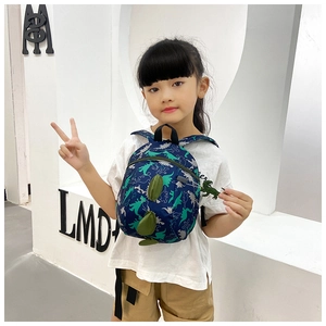 Toddler boy dinosaur backpack in navy blue with green spikes and cute plush keychain