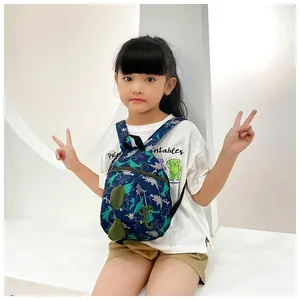 Detail of navy toddler dinosaur backpack with 3D spikes and playful cartoon prints