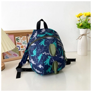 Detail view of toddler dinosaur backpack with 3D fins and blue silhouette patterns