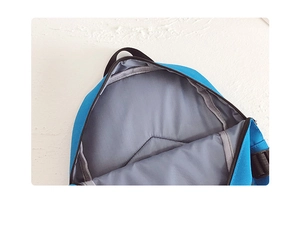 Detail view of the spacious blue children backpack interior with durable gray lining