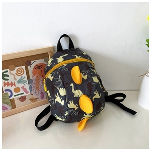 Detail of cute dinosaur backpack featuring yellow cartoon patterns and 3D spikes for kids