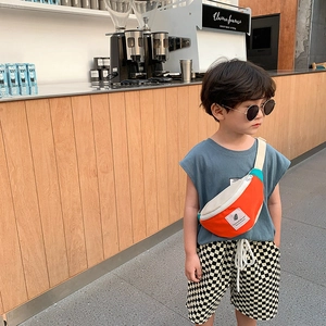 Sac bandoulière enfant tendance avec patchwork contrasté orange, beige et bleu