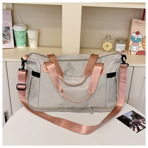 Detail of travel bag with spacious bottom compartment and adjustable straps