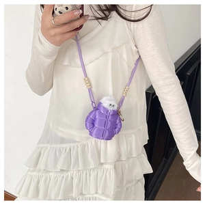 Detail of purple mini down jacket bag with cute monster plush and bead strap detail