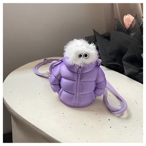 Detail showing mini purple puffer jacket bag with plush white fur and playful eye design