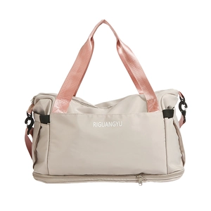 Off-white large capacity travel bag with pink handles and separate bottom compartment