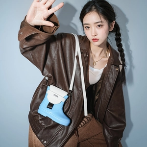 Cute sky blue rain boot shaped crossbody bag with white flap and adjustable strap