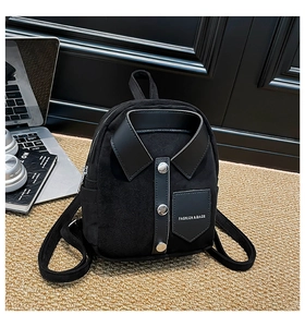Detail of black mini shirt-style backpack with suede texture and silver buttons