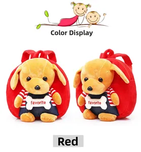 Detail of red plush toddler backpack featuring a cute yellow puppy doll in overalls