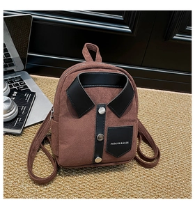 Detail of a brown suede mini backpack featuring creative shirt collar and button design