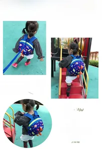 Detail of blue toddler dinosaur backpack featuring anti-lost safety leash and 3D spikes
