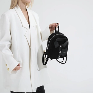 Minimalist black shirt-style mini backpack for women featuring unique button-down design