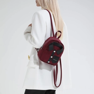 Fashionable burgundy mini backpack with shirt-collar design and metal buttons