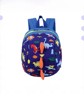 Front view of dark blue children backpack with colorful dinosaur print and 3D orange horns