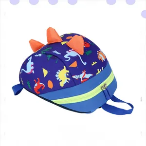 Flat lay of navy blue dinosaur kids backpack with orange fins and yellow zippers