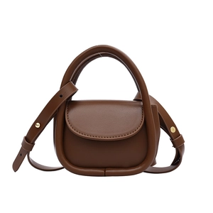 Brown leather mini handbag with top handle and adjustable gold-buckle shoulder strap