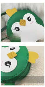 Macro detail of the smooth stitching and penguin design on a green mini shoulder bag