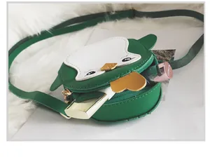 Interior view of mini penguin crossbody bag showing capacity for lipsticks and small items