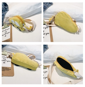 Detail view showing yellow car-shaped corduroy chest bag with zipper and inner lining