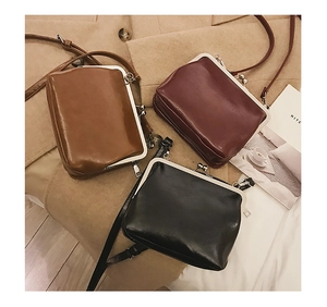 Vintage metal clasp crossbody bags in black, caramel brown, and deep burgundy faux leather