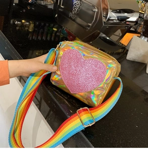 Detail of laser patent leather heart bag with adjustable rainbow wide shoulder strap