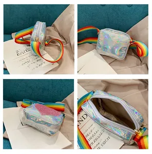 Detail of silver laser leather crossbody bag for kids with rainbow strap and heart motif