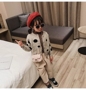 Girl's autumn outfit featuring gray polka dot cardigan and pink sequin chain crossbody bag
