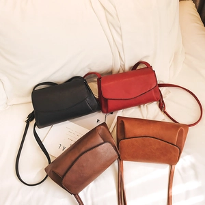 Minimalist soft PU leather crossbody bags in four colors on a white bedding background