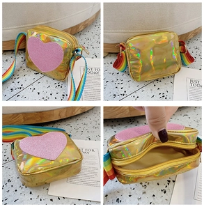 Detail view showing laser PU material, glitter heart and rainbow strap of child's bag