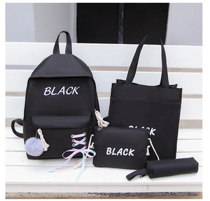 Ensemble détaillé de 4 sacs à dos en toile noire avec lettrage blanc et rubans