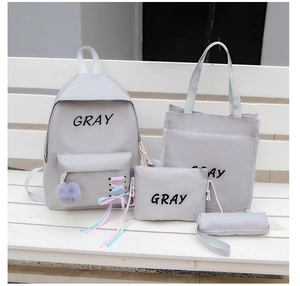 Ensemble scolaire 4 pièces gris avec sac à dos, fourre-tout, sac bandoulière et une trousse