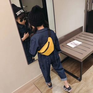 Kids yellow canvas belt bag in moon shape shown on a model with mirror reflection view