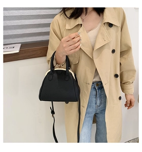 Classic black litchi pattern shell bag with golden metal clasp and crossbody strap
