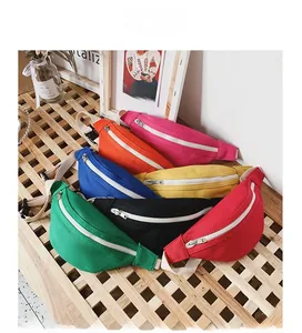 Detailed display of colorful mini canvas chest bags on a wooden bench for kids