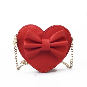 Kids cute red heart-shaped crossbody bag with a large bow and gold chain strap