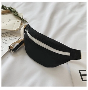 Detail view of black canvas kids waist bag with white zipper and adjustable strap