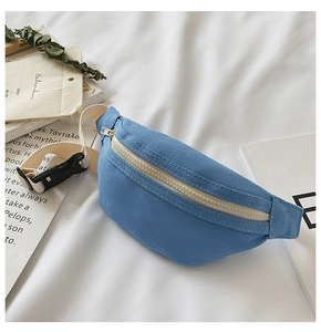 Detail of navy canvas waist bag for kids with cream zipper and adjustable nylon strap
