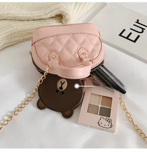 Internal view of a pink quilted mini shell bag showing capacity with gold chain strap