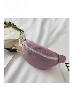 Close-up of purple canvas kids waist bag with adjustable strap and zipper detail