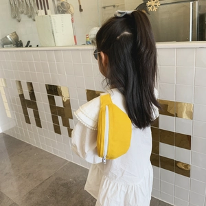 Bright yellow canvas crossbody chest bag for girls featuring a stylish half-moon design